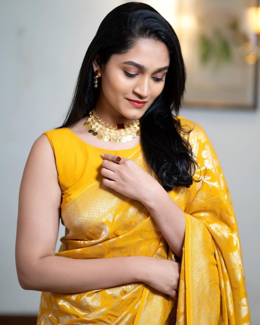 Mustard yellow Kanjivaram Banarasi soft silk saree with zari floral weave full body view